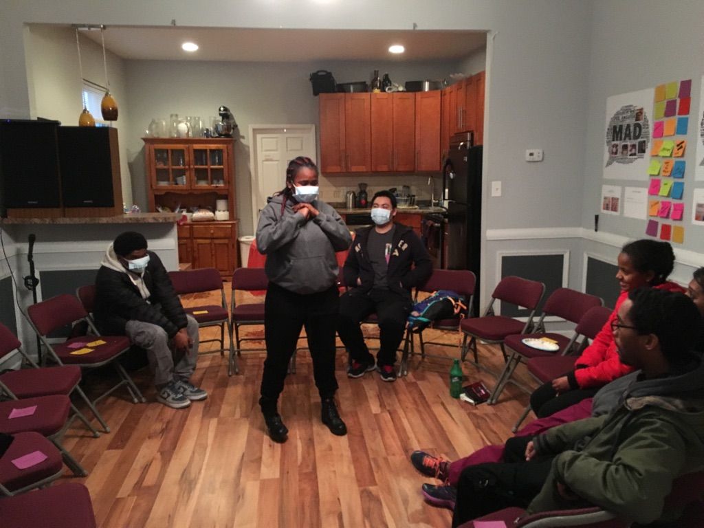 Teva interns take part in activities with Tieshka Smith at her installation, Racism is a Sickness