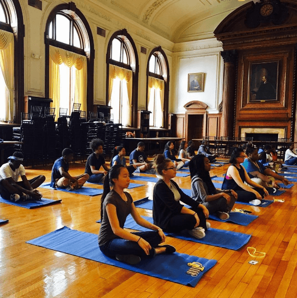 Students in the Karabots Junior Fellows Program take part in a yoga session.