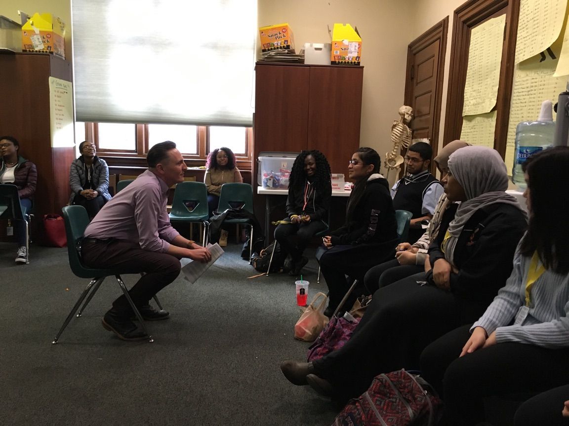 Jon Goff, Associate Director of Fellow Ship Relations for the College of Physicians of Philadelphia, conducts a mock job interview with Viviana, a student in the Karabots Junior Fellows Program. The two are seated opposite each other (Goff to the left, Vi