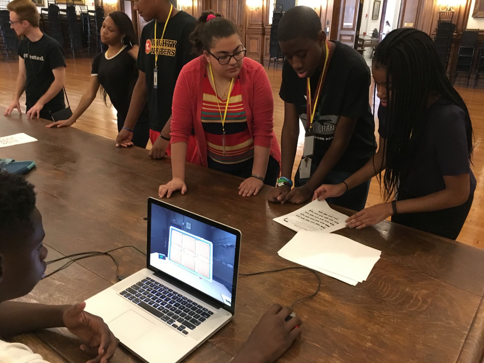 Students in the Karabots Junior Fellows Program play the cooperative computer game "Keep Talking and Nobody Explodes"