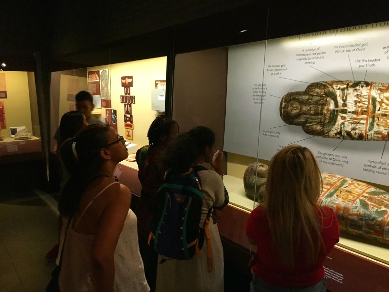 Students from the Teva Internship Program explore the mummies exhibit at the Penn Museum