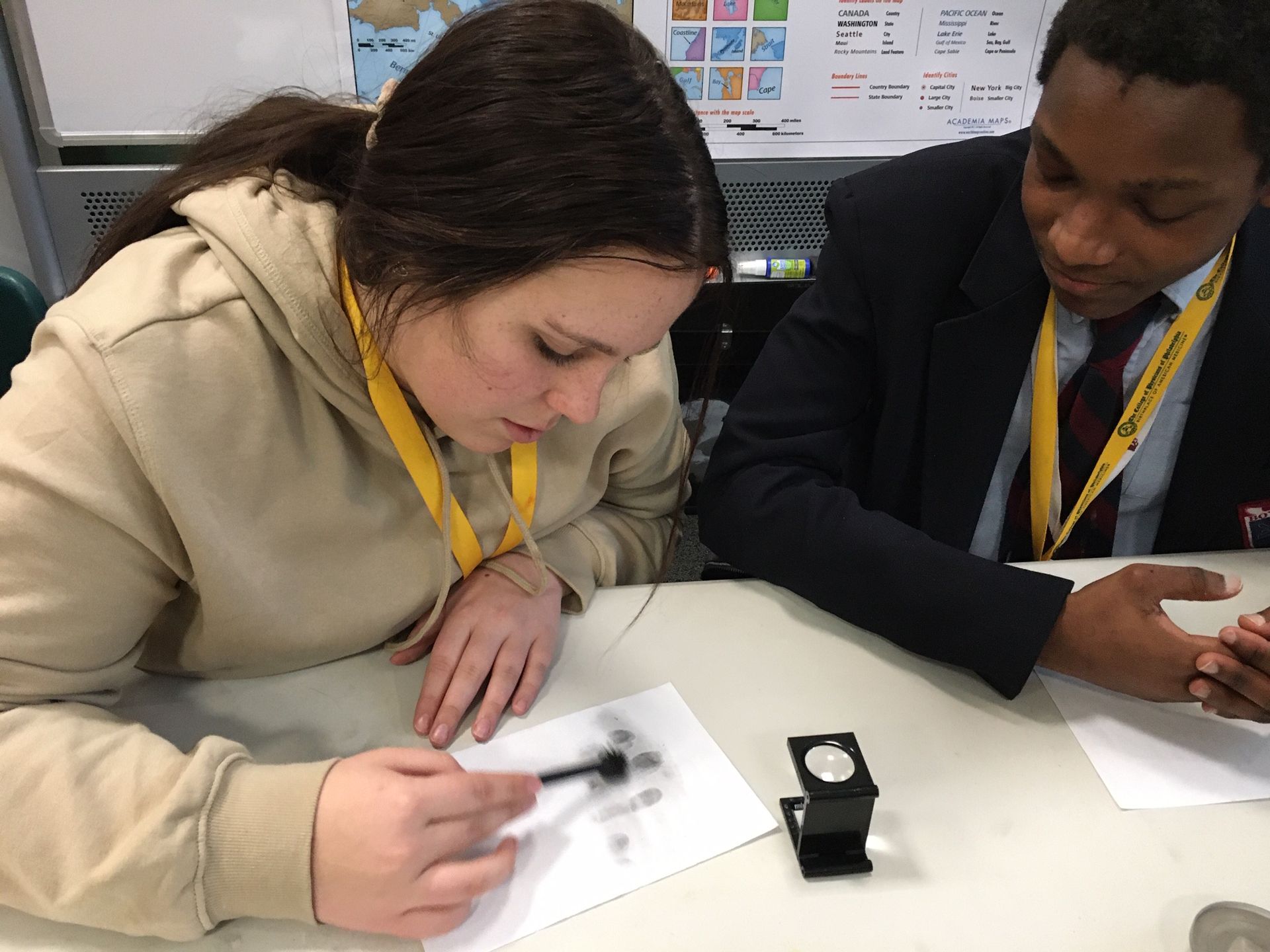 Two students in the Karabots Junior Fellows Program examine fingerprints