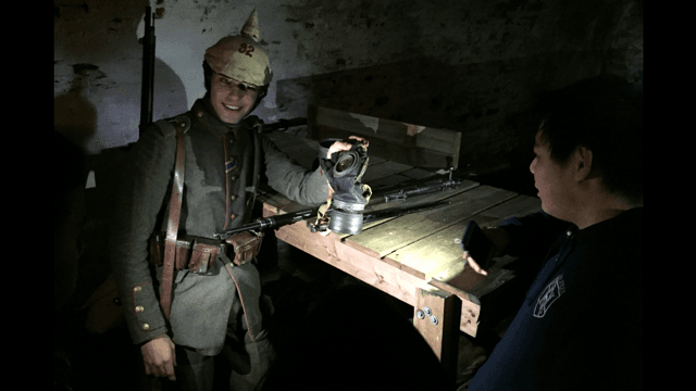 A Teva fellow learns about the life of a World War I soldier from a German re-enactor at Fort Mifflin