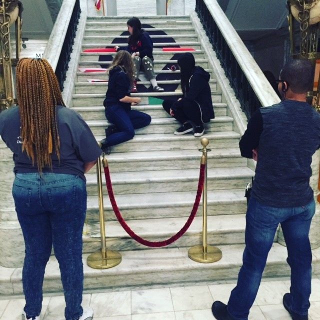 Students in the Karabots Junior Fellows Program assembling the ribbon for National Black HIV/AIDS Awareness Day, on the College of Physicians steps, 2/7/2016