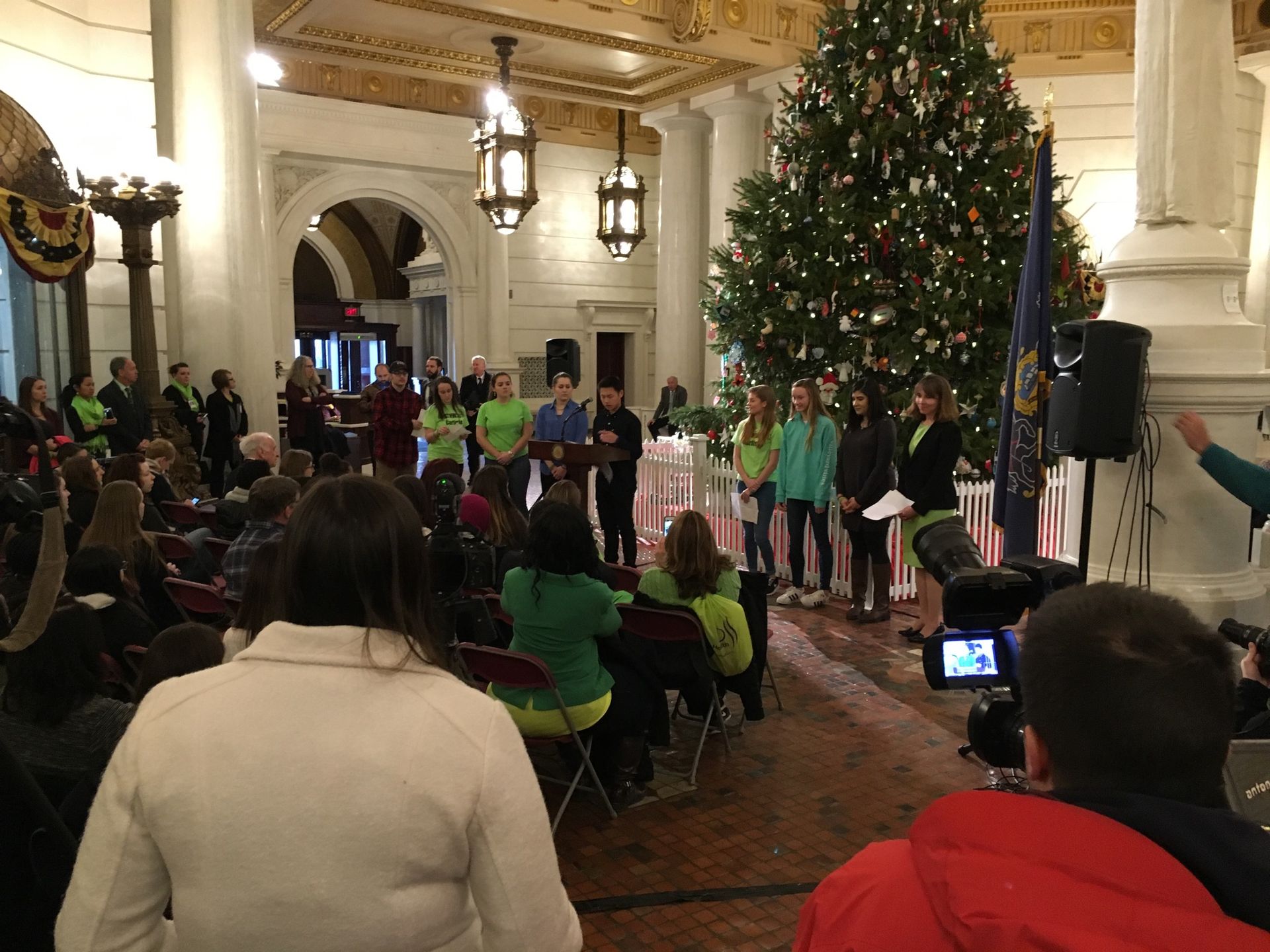 Teva intern Su Ly stands at a podium in front of attendees to the proclamation of Pennsylvania Teen Health Week 2017 at the Pennsylvania State House
